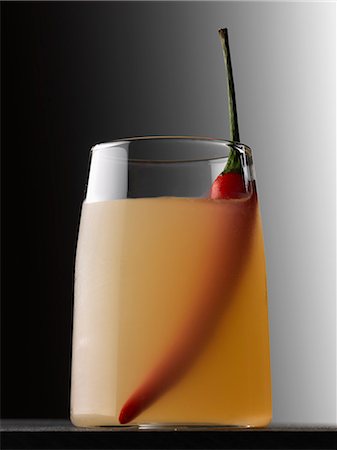 Vodka,orange and red hot pepper cocktail Stock Photo - Premium Royalty-Free, Code: 652-06818901