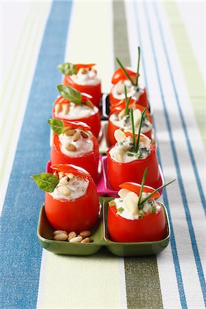 simsearch:652-06818883,k - Small raw tomatoes stuffed with roquefort cream and almonds Photographie de stock - Premium Libres de Droits, Code: 652-06819045