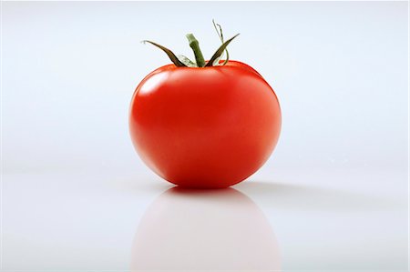 Tomato on a white background Stock Photo - Premium Royalty-Free, Code: 652-06819202