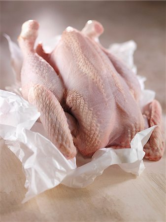 Whole raw chicken Stock Photo - Premium Royalty-Free, Code: 652-06819303