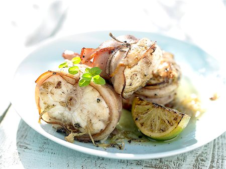 Monkfish wrapped in bacon with lemon Stock Photo - Premium Royalty-Free, Code: 652-07655110