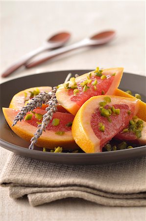 simsearch:652-05806950,k - Pomelos fruit salad with pistachios and essential lavander oil Stock Photo - Premium Royalty-Free, Code: 652-07655442