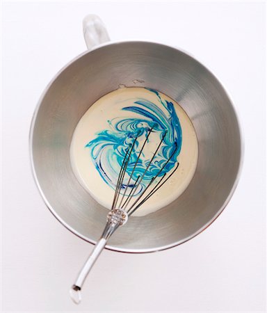 simsearch:652-07655478,k - Adding the food coloring to the batter Stock Photo - Premium Royalty-Free, Code: 652-07655474