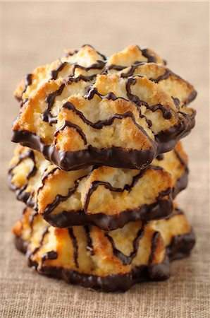 simsearch:652-07655550,k - Three stacked coconut and chocolate Rochers Photographie de stock - Premium Libres de Droits, Code: 652-07656014