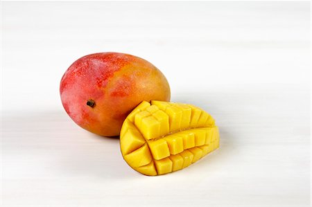 simsearch:652-07656127,k - Mangoes on a white background Stock Photo - Premium Royalty-Free, Code: 652-07656122