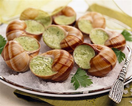 Escargots au beurre de persil Photographie de stock - Premium Libres de Droits, Code: 652-01667843