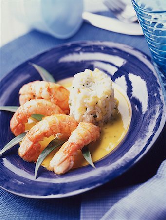simsearch:652-01669644,k - pan-fried Dublin Bay prawns with pineapple and passion fruit coulis Stock Photo - Premium Royalty-Free, Code: 652-01668713