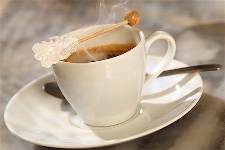 sugar stick placed on coffee cup Stock Photo - Premium Royalty-Free, Code: 652-01669214