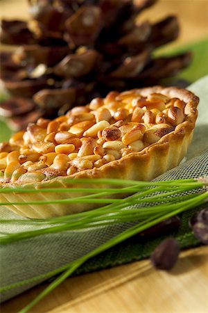 simsearch:652-01668450,k - Almond and pine nut tart Stock Photo - Premium Royalty-Free, Code: 652-01669303