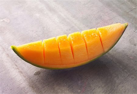 slice of melon Stock Photo - Premium Royalty-Free, Code: 652-01670346
