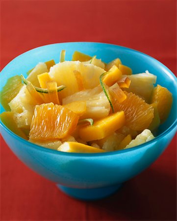 exotic fruit bowl - Pineapple,orange,mango and lime fruit salad Stock Photo - Premium Royalty-Free, Code: 652-02221359