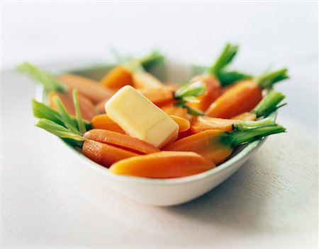 early fruit - Steam-cooked carrots with a nut of butter Stock Photo - Premium Royalty-Free, Code: 652-02221352