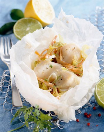 Scallops and lemon in papillote Stock Photo - Premium Royalty-Free, Code: 652-02221373