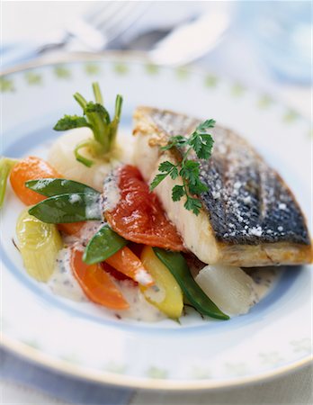 grilled piece of bass with granulated salt and young vegetables Stock Photo - Premium Royalty-Free, Code: 652-02221560