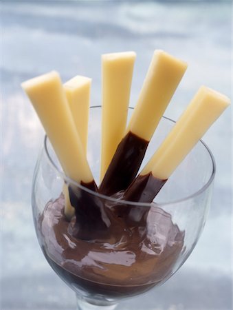 Comté sticks and melted chocolate Stock Photo - Premium Royalty-Free, Code: 652-02221836