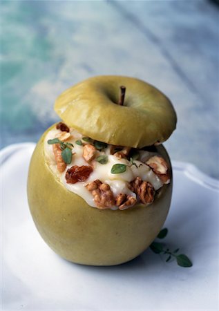 baked apple stuffed with neufchatel cheese and walnuts Stock Photo - Premium Royalty-Free, Code: 652-02221839