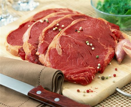 red pepper and garlic - Rump steaks Stock Photo - Premium Royalty-Free, Code: 652-02221888