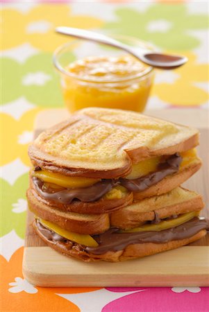 spreading chocolate - Chocolate and mango toasted sandwich Stock Photo - Premium Royalty-Free, Code: 652-03634288