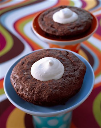 Chocolate soufflé cake and whipped cream Stock Photo - Premium Royalty-Free, Code: 652-03634463