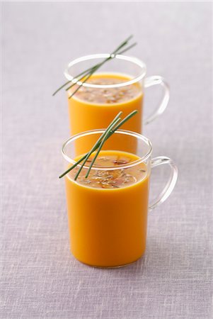 Glass cups of carrot soup Stock Photo - Premium Royalty-Free, Code: 652-03635200