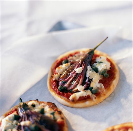 Mini eggplant pizzas Stock Photo - Premium Royalty-Free, Code: 652-03633250