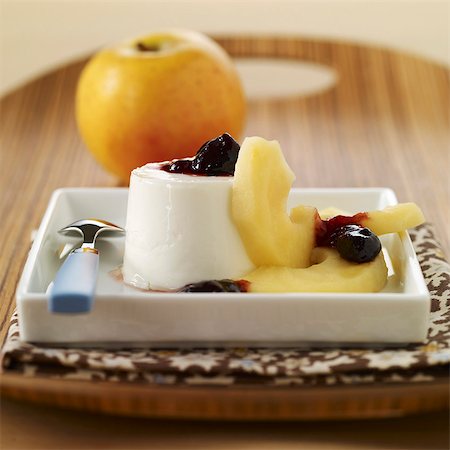 Curdled ewe's milk dessert with stewed apples and black cherry jam Stock Photo - Premium Royalty-Free, Code: 652-03804370