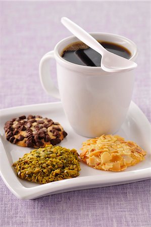 Cup of coffee and three different flavored crunchy cookies Stock Photo - Premium Royalty-Free, Code: 652-03804468