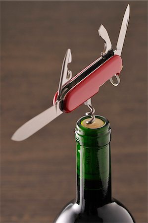 simsearch:652-02222200,k - Openning a bottle of wine with a corkscrew on a pocket knife Stock Photo - Premium Royalty-Free, Code: 652-03804566