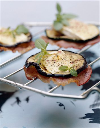Grilled eggplant,bacon and Brie appetizers Stock Photo - Premium Royalty-Free, Code: 652-03804624