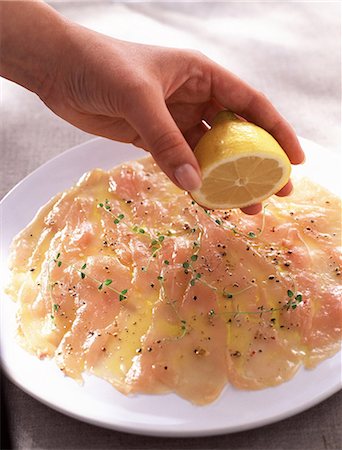 plate and food and chicken - chicken carpaccio with lemon Stock Photo - Premium Royalty-Free, Code: 652-03800186