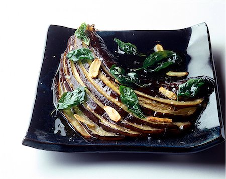 baked aubergines with garlic and fried basil Stock Photo - Premium Royalty-Free, Code: 652-03800190