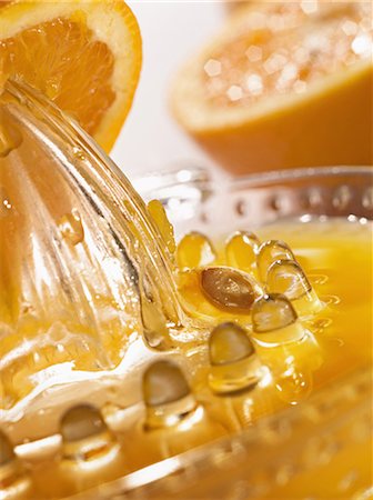squeezer - Squeezing fresh orange juice Stock Photo - Premium Royalty-Free, Code: 652-03800428