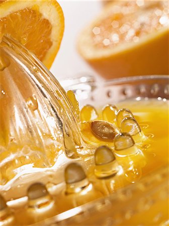 simsearch:825-05986103,k - Squeezing fresh orange juice Stock Photo - Premium Royalty-Free, Code: 652-03800428