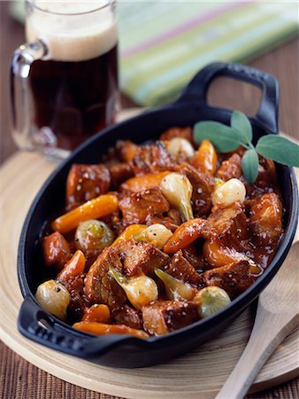 Caramelized pork stew with onions and new carrots Stock Photo - Premium Royalty-Free, Code: 652-03800621