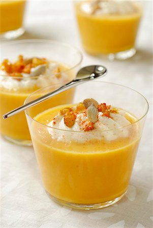 Pumpkin soup with salted whipped cream and squash seeds Stock Photo - Premium Royalty-Free, Code: 652-03800937