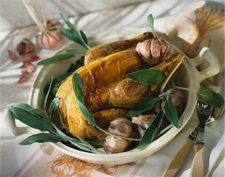 Roast guinea-fowl with sage and garlic Stock Photo - Premium Royalty-Free, Code: 652-03800990