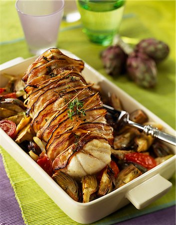 roast (cut of meat) - Roast monkfish wrapped in bacon with artichokes Stock Photo - Premium Royalty-Free, Code: 652-03801302