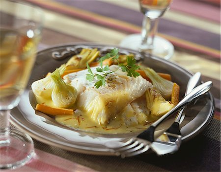 simsearch:652-06818828,k - Bass with artichokes and onions,white wine and saffron sauce Stock Photo - Premium Royalty-Free, Code: 652-03801332
