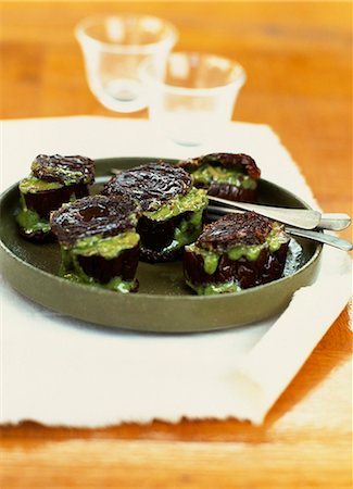 Sliced eggplant stuffed with greens and confit tomatoes Stock Photo - Premium Royalty-Free, Code: 652-03801728