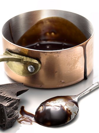 Saucepan of melted chocolate and spoon Stock Photo - Premium Royalty-Free, Code: 652-03802248
