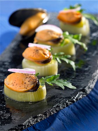 Leek and mussel bite-size appetizers Foto de stock - Sin royalties Premium, Código: 652-03802354