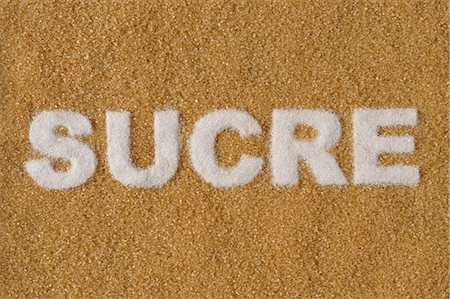 simsearch:652-03803428,k - The word"Sucre" written with white sugar on brown sugar Foto de stock - Sin royalties Premium, Código: 652-03802409