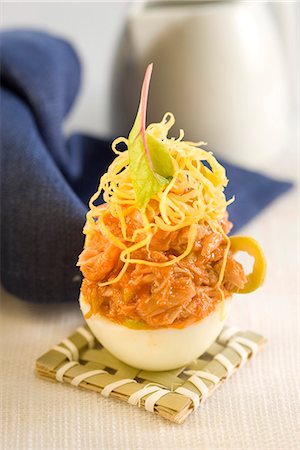 egg aperitif - Hard-boiled egg stuffed with tuna and tomato mix Stock Photo - Premium Royalty-Free, Code: 652-03802684