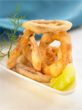 Deep-fried onion rings Foto de stock - Sin royalties Premium, Código: 652-03802718