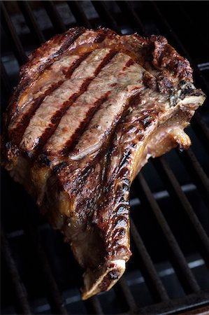 steak on grill - T-bone steak on the grill Stock Photo - Premium Royalty-Free, Code: 652-03802880