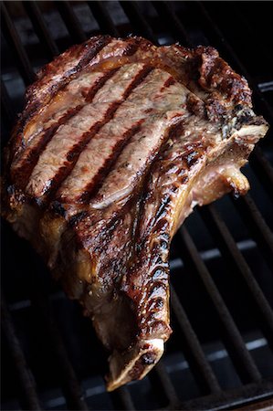 T-bone steak on the grill Stock Photo - Premium Royalty-Free, Code: 652-03802880