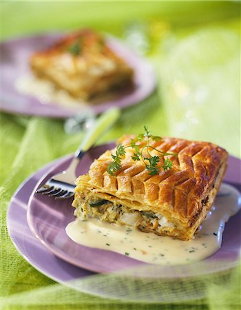 Cod and vegetable flaky pastry pie with chive sauce Stock Photo - Premium Royalty-Free, Code: 652-03802985