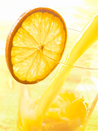 drink flowing - Pouring a glass of orange juice Stock Photo - Premium Royalty-Free, Code: 652-03803025