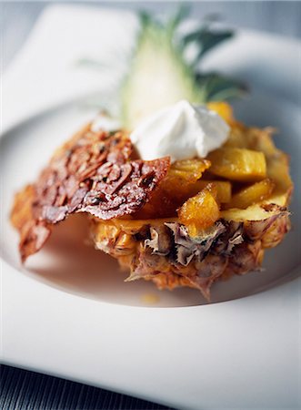 diced fruit - Pan-fried pineapple with rum,whipped cream and almond tuile biscuit Foto de stock - Sin royalties Premium, Código: 652-03803038