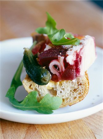 Chicken and beetroot terrine on a piece of bread Stock Photo - Premium Royalty-Free, Code: 652-03803119